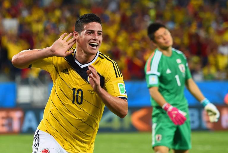 CUIABA, BRAZIL - JUNE 24:  James Rodriguez of Colombia celebrates scoring his team's fourth goal past goalkeeper Eiji Kawashima of Japan during the 2014 FIFA World Cup Brazil Group C match between Japan and Colombia at Arena Pantanal on June 24, 2014 in Cuiaba, Brazil.  (Photo by Christopher Lee/Getty Images)