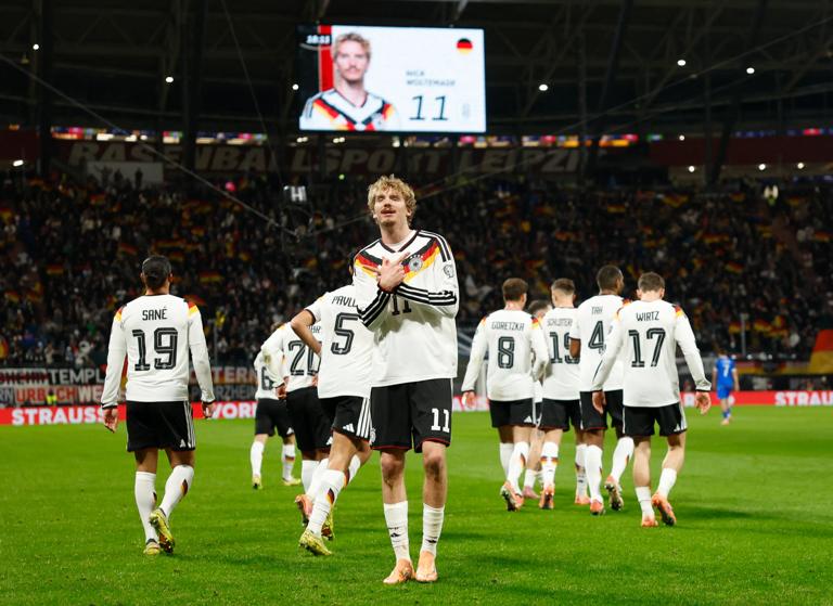 Germany's forward #11 Nick Woltemade celebrates scoring his team's first goal during the FIFA World Cup 2026 European qualification Group A football match between Germany and Slovakia, at the Red Bull Arena in Leipzig, eastern Germany on November 17, 2025. (Photo by Odd ANDERSEN / AFP) (Photo by ODD ANDERSEN/AFP via Getty Images)          