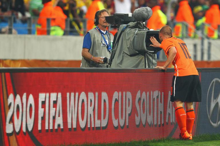 PORT ELIZABETH, SOUTH AFRICA - JULY 02:  Wesley Sneijder of the Netherlands celebrates the own goal by Felipe Melo of Brazil by waving into a TV camera during the 2010 FIFA World Cup South Africa Quarter Final match between Netherlands and Brazil at Nelson Mandela Bay Stadium on July 2, 2010 in Nelson Mandela Bay/Port Elizabeth, South Africa.  (Photo by Richard Heathcote/Getty Images)